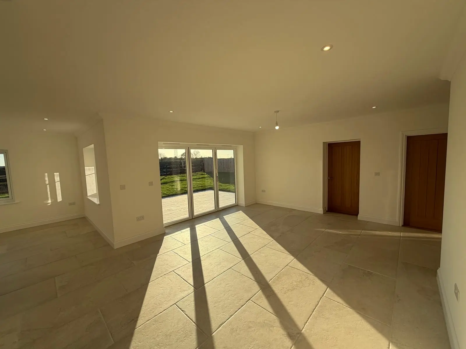 sun coming through window in a freshly tiled kitchen floor